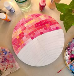 a table topped with lots of crafting supplies on top of a white countertop