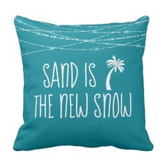 a blue pillow that says sand is the new snow