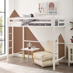 a white loft bed sitting next to a chair in a living room under a window