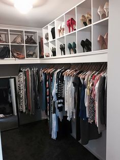 the closet is full of clothes and shoes