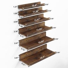 the wooden shelves are labeled with measurements for each shelf in this photo, and one is tall