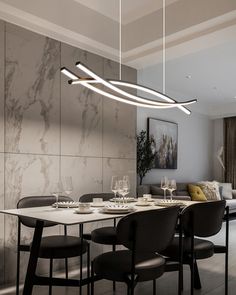 a modern dining room with marble walls and black chairs, an oval light fixture hanging from the ceiling