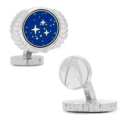 a pair of cufflinks with stars in the sky on top of each other