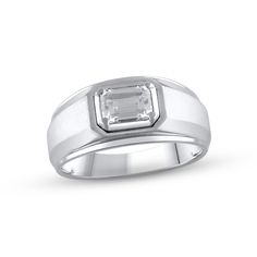 a men's ring with an emerald stone in the center and a white background