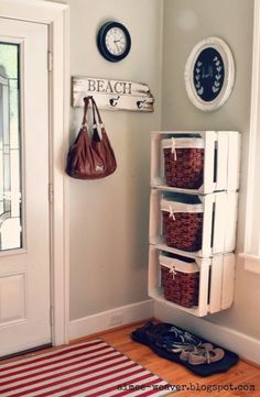 a white door and some baskets on the floor