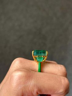 For Sale on 1stDibs - Make a statement with this three stone cocktail ring, with 19.69 carat center stone Zambian Emerald with 2.01 carat side-stone Emeralds. All set in 18K Luxury Oval Emerald Ring With Three Stones, Luxury Gold Emerald Ring With Three Stones, Luxury Three Stone Emerald Ring For Formal Occasions, Luxury Emerald Three Stone Ring For Formal Occasions, Luxury Three Stone Emerald Ring For Formal Events, Luxury Oval Three Stone Emerald Ring, Luxury Three Stone Emerald Ring Gift, Luxury Three Stone Emerald Ring, Luxury Gold Emerald Cut Gemstones