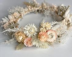 A white flower crown made with ivory white and light pink dried flowers Dried Floral Crown, Dry Flower Crown, Wedding Hair Bride, Flower Crown Wedding Hair, Wedding Hair Flower Crown, Crown Wedding Hair, Dried Flower Crown, Flower Garland Wedding, Eucalyptus Bouquet