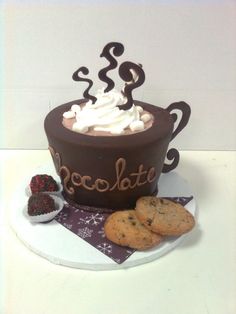 a chocolate cup with whipped cream and cookies