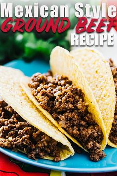 three mexican style ground beef tacos on a blue plate