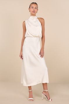 No one will be able to deny your luxe presence in the En Saison Greta Champagne Crinkle Satin Mock Neck Sleeveless Midi Dress! Crinkly textured satin shapes this ultra-chic dress that features a mock neckline with long sash ties that secure at the back, atop a keyhole-style cutout. Asymmetrical, sleeveless bodice has pleated details at the shoulders and a cutout-like silhouette, while gathering at the fitted waist tops a figure-skimming midi skirt. Hidden back zipper/clasp. Fit: This garment fit Midi Dress Satin, Mock Neck Midi Dress, Engagement Photo Dress, Rehearsal Dinner Dresses, Rehearsal Dress, Bach Party, Adhesive Bra, Sleeveless Midi Dress, Dinner Dress