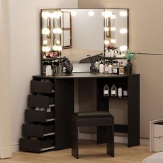 a dressing table with stool and mirror in a room that has lights on the wall