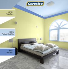 a bedroom with yellow walls and blue trim on the ceiling is shown in this image