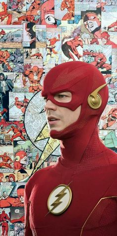 the flash standing in front of a wall covered with comic character images and photos,