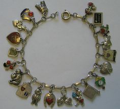 the charm bracelet has many charms on it