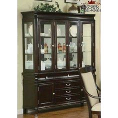 a dining room table with chairs and a china cabinet