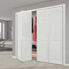 an open closet with white shutters in a bedroom