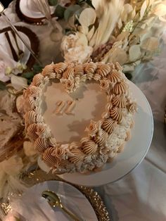 a heart shaped cake sitting on top of a table