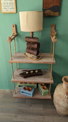 three tiered shelving unit with two lamps on each shelf