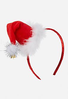 a red and white santa hat on top of a headband