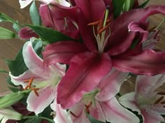 a vase filled with pink and white flowers