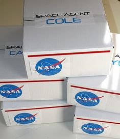 four nasa boxes stacked on top of each other