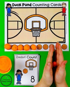 a person holding their hands over a basketball counting game