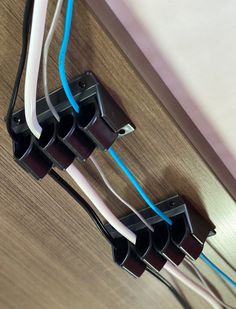 three wires are connected to the wall in an electrical outlet with blue and white wires