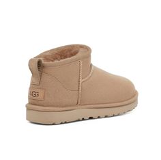 The Classic Ultra Mini updates our most iconic silhouette with a lower shaft height, adding easy on-off and enhanced versatility. Pre-treated to keep it looking better for longer, this Classic features everything you love about the original like signature UGG sheepskin and a flexible, lightweight sole. Wear with virtually anything – the styling options are endless. Ugg Classic Mini Chopd, Ugg Ultra Mini Beige, Sand Ultra Mini Uggs, Ugg Ultra Mini Ii, Ugg Ultra Mini Sand, Ugh Ultra Mini, Uggs Mini, Ugg Mini Boot, Cute Uggs