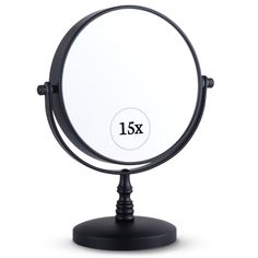 a round mirror on a stand with the number 13x in it's center