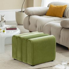 a living room filled with furniture and a white coffee table