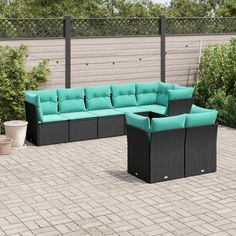 an outdoor patio furniture set with blue cushions