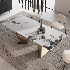 a marble table with chairs around it in a living room area that has black and white decor