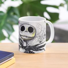 a coffee mug with a skeleton painted on it