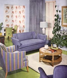 a living room with blue couches and striped chairs in it's center area