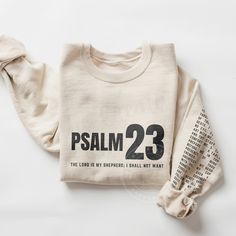 a white sweatshirt with the words, i am 23 printed on it