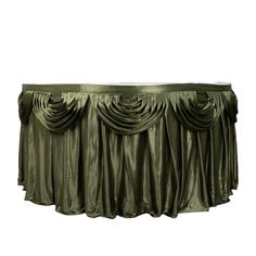 a green table skirt with pleated drapes