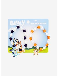 two bracelets with cartoon characters on them in front of a blue sky and stars background