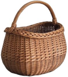 a brown wicker basket with handle on a white background