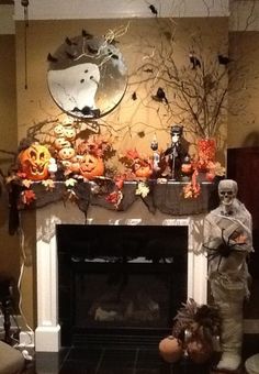 a living room decorated for halloween with pumpkins and decorations