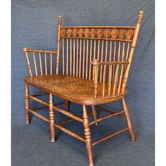 a wooden chair sitting on top of a gray floor