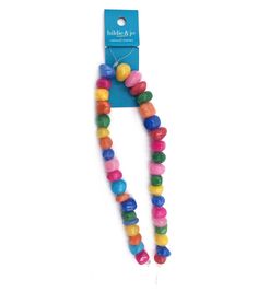 a necklace with multicolored beads and a white tag on it's side