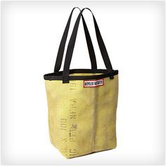 a yellow tote bag with black straps