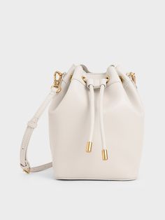 Chic Bucket Bags: 🪣 Elevate Your Style with Chic Bucket Bags! 👜✨ Latest Bags, Drawstring Bucket Bag, Size Chart For Kids, Embellished Top, Charles Keith, Belt Size