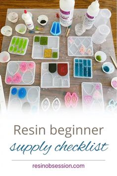 a table topped with plastic containers filled with crafting supplies and text reading resin beginner supply checklist