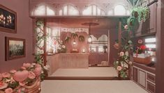 the interior of a house with pink flowers and potted plants