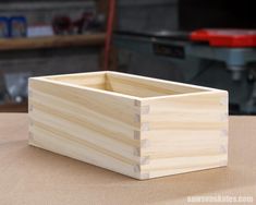 a wooden box sitting on top of a table