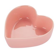 a pink heart shaped dish on a white background