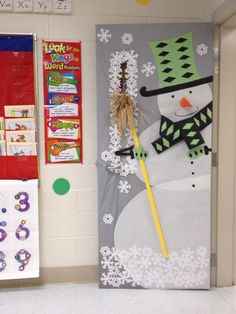 a classroom door decorated with snowmen and decorations