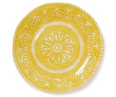 a yellow and white plate with an intricate design on the rim, isolated against a white background