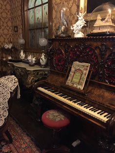 an ornately decorated room with a piano